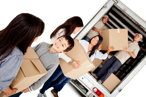 Moving home service in Harefield with boxes and furniture ready for transport