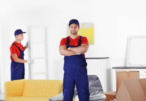 Professional movers loading household items for a Harefield relocation