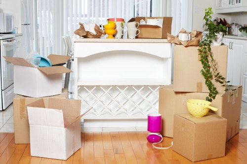 A moving team handling boxes and furniture in Harefield