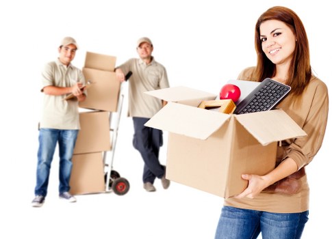 Packed moving boxes and furniture in a Harefield home