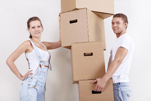 Professional movers loading a van for a local move