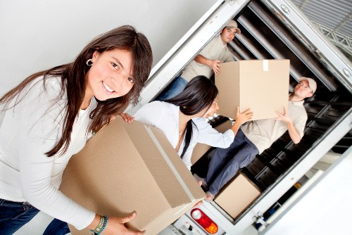 Loading furniture and boxes into a removals van in Harefield
