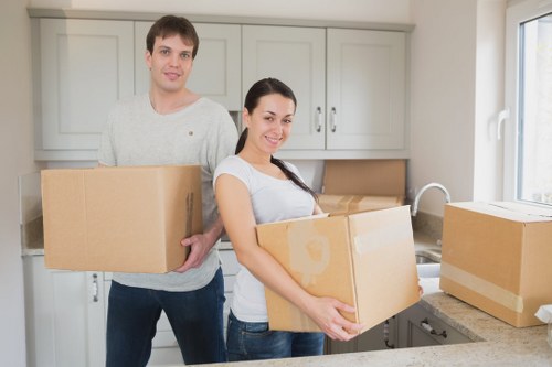 Careful loading of household items into a moving van